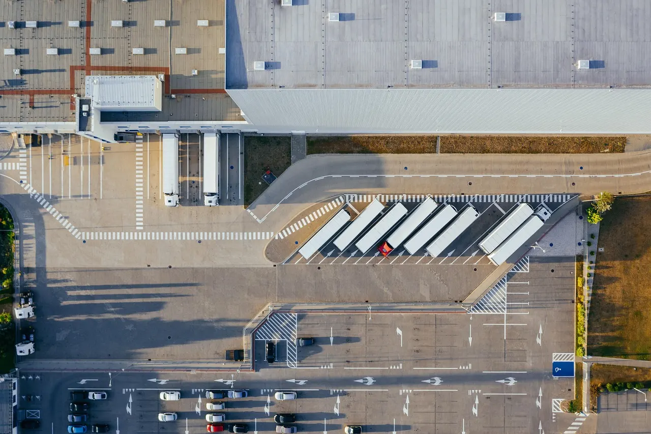 Warehouse loading area where pallets are staged for heavy vehicle dispatch